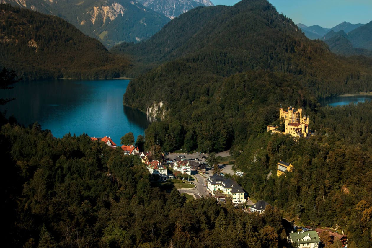 View of Hohenschwangau from Neuschwanstein Castle // Neuschwanstein Castle is Germany's most photographed and popular fairytale castle. Keep reading for a complete guide to visiting Neuschwanstein Castle including photos, how to get there from Munich, how to buy tickets and more. 