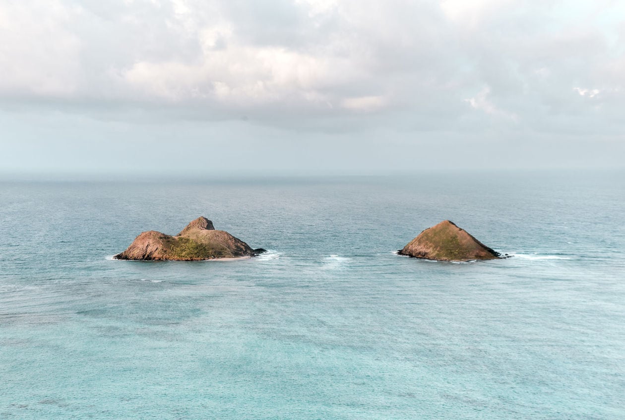 Mokulua Islands // 20 beautiful pictures of Oahu, Hawaii that capture all of the Aloha vibes; from jungle waterfalls, white sand beaches and colorful sunsets, keep reading to ignite your wanderlust and inspire your next visit to the Hawaiian Islands.